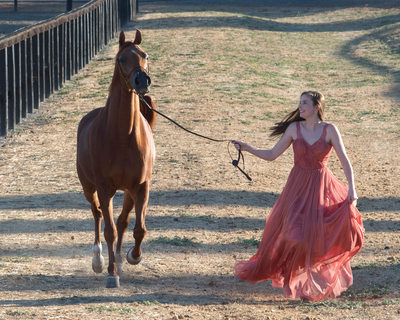 Horse Photography with High School Senior running with Dress Flowing