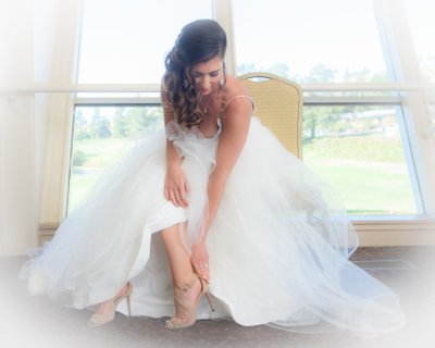 Dreamy Bridal Prep Photo as Bride Puts on her Shoes