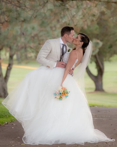 Bride kissing Groom on Bay Area Golf Course in San Francisco