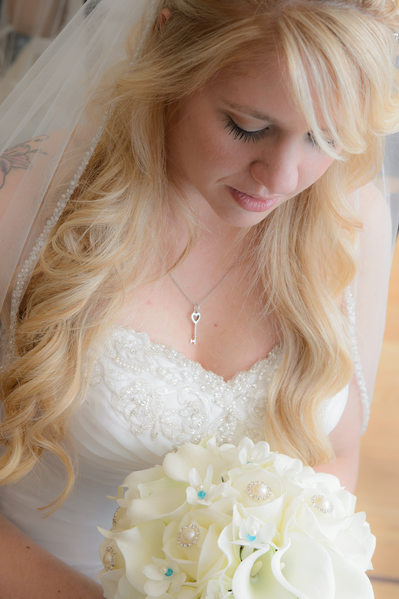 Bay Area Bride Looking Down at Wedding Bouquet