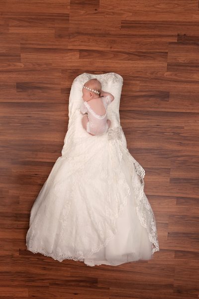 Little girl on mommas wedding dress, lace