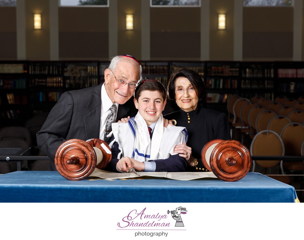 Portrait of a Boy with His Grandparents Reading Torah