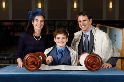 Happy Portrait of a Boy and His Parents on Bar Mitzvah
