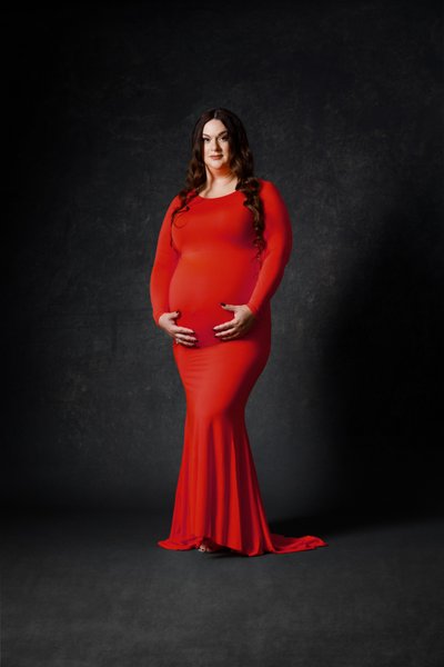 Awaiting the Miracle: Maternity Portrait of a Lady in a Long Red Dress