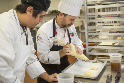Culinary Instructor teaching student