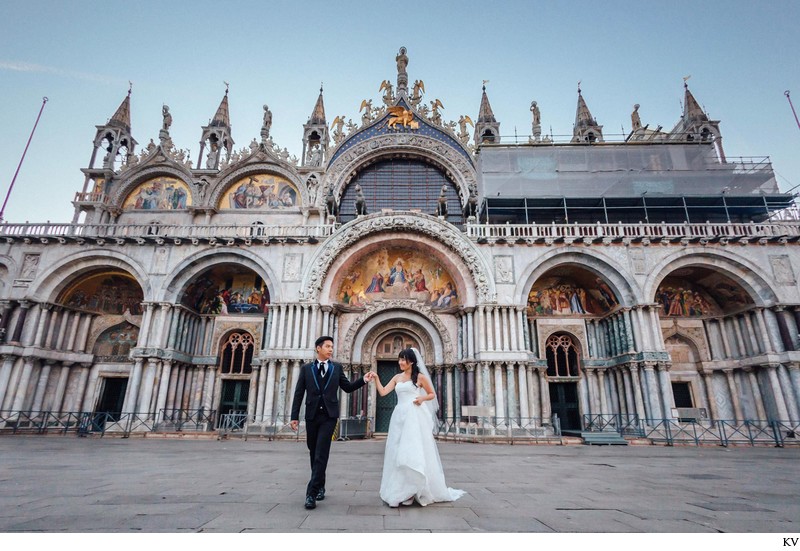 walking in front of St Mark's Basilica pre wedding