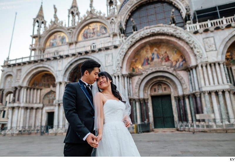 wedded couple in front of St Mark's Basilica Venice