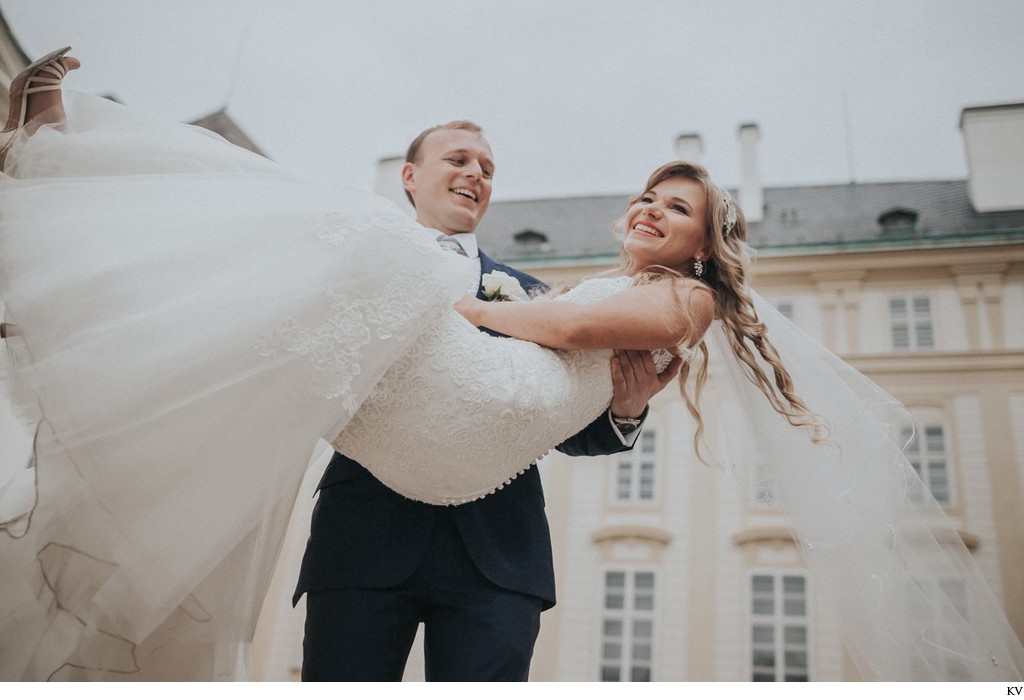 Spinning his bride at Prague Castle during wedding day