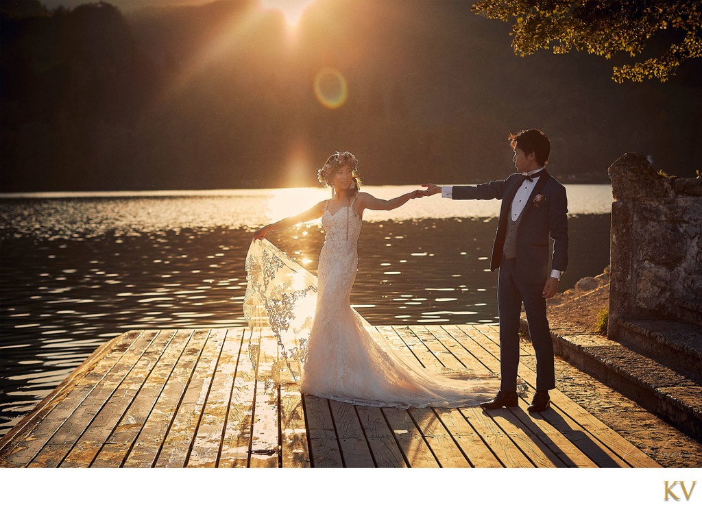 celebrating their wedding in the Golden Light Lake Bled