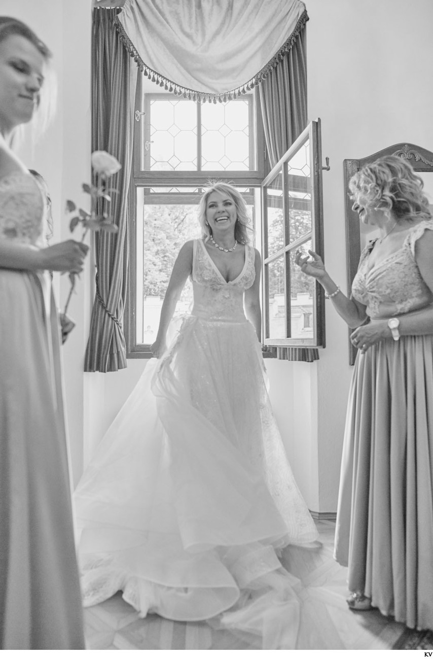 B&W portrait of the happy bride from her castle wedding
