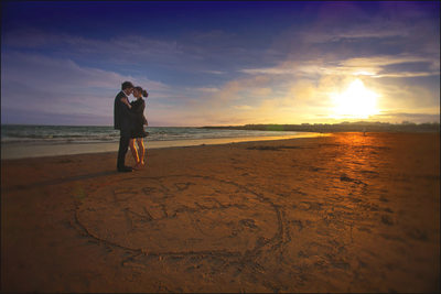 Brid & Nial beach engagement session names in sand