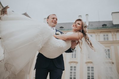 Spinning his bride at Prague Castle during wedding day