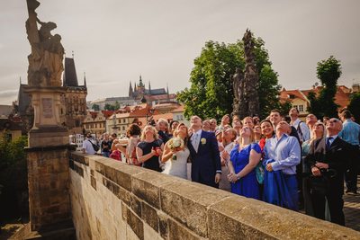 wedded couple and guests watch the balloons rise