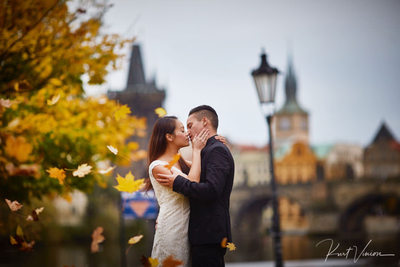 A Prague engagement photographed in Rain Charles Bridge