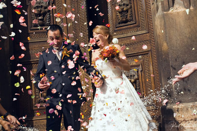 Prague wedding couple showered in rose petals & rice 