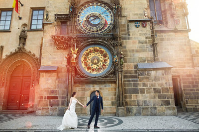 sexy, stylish couple under the Astronomical Clock