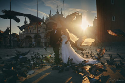 bride & groom walking in Piazza San Marco at sunrise