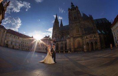 bride & groom walking near St. Vitus Cathedral