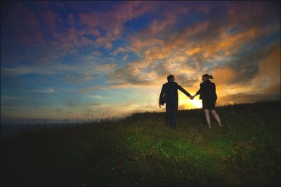 walking hand in hand towards the sunset Galway Ireland
