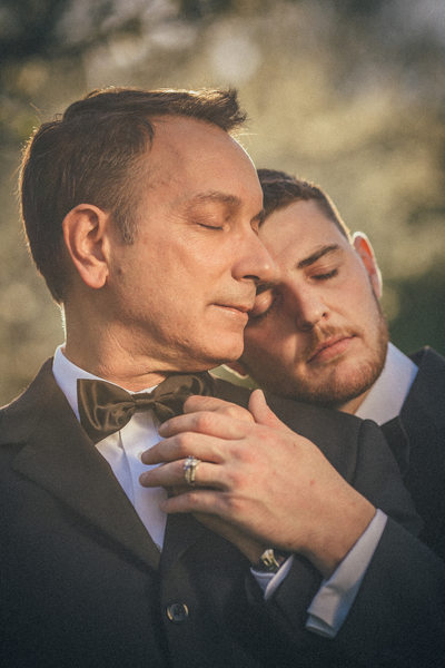 portrait of two men during their engagement session