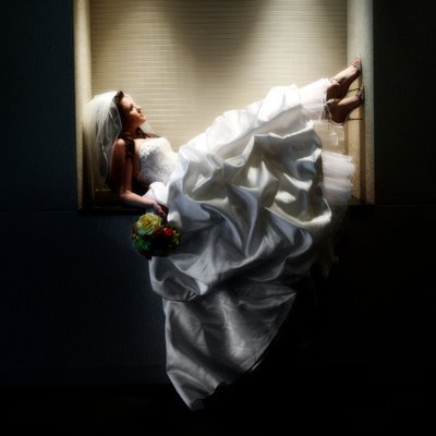 ​Bride with canned light on dress.