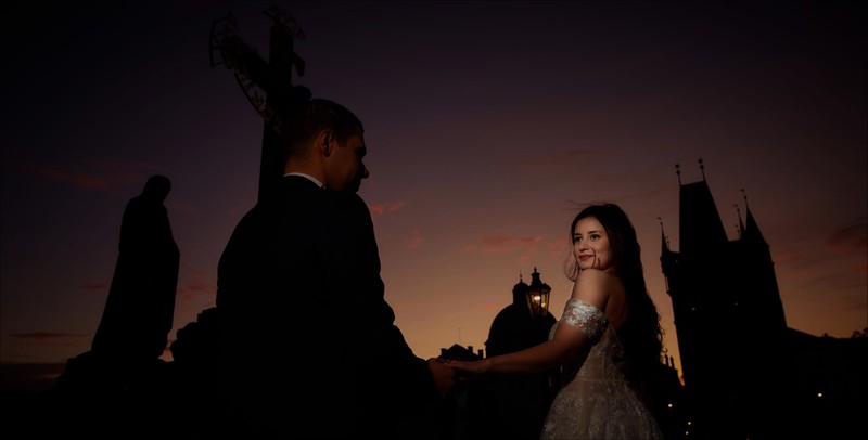 Taking her groom by his hand twilight Charles Bridge