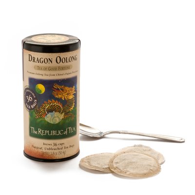 Dragon OOlong Tea tin and bags on a white background