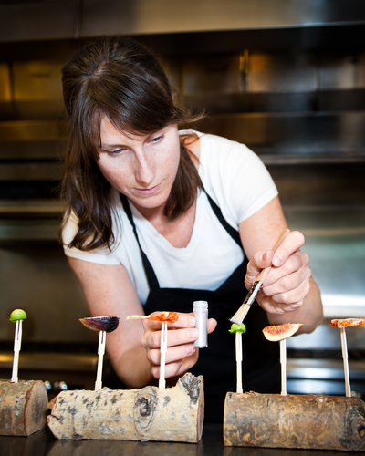 Chef Katie Weinner adds the finishing touch