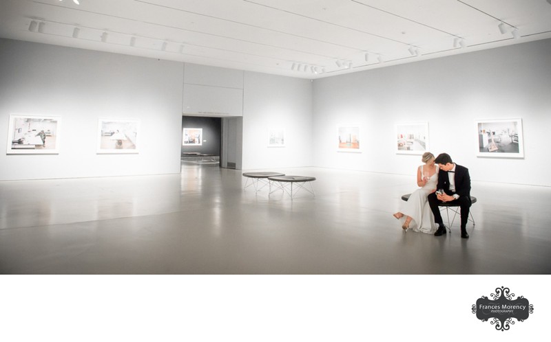 Couple takes a Moment Alone in the Art Gallery