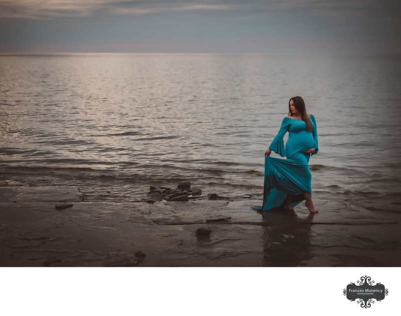 Girl Wearing Blue Maternity Dress in the Water