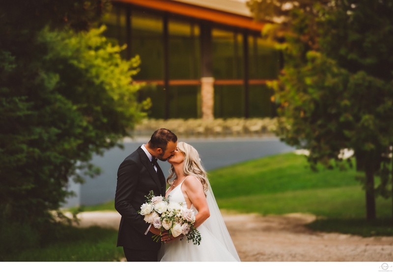 Couple Kissing with Alpine Ski Club in Background