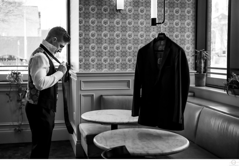 Groom Prep Photo in Restaurant:  Toronto Wedding Photographer