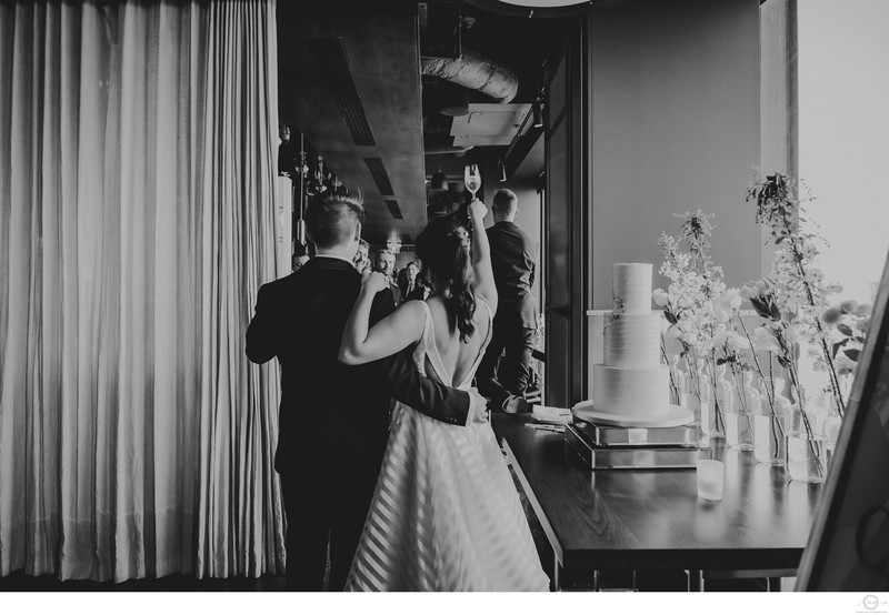 Couple Toasting Guest:  Toronto Wedding Photographer