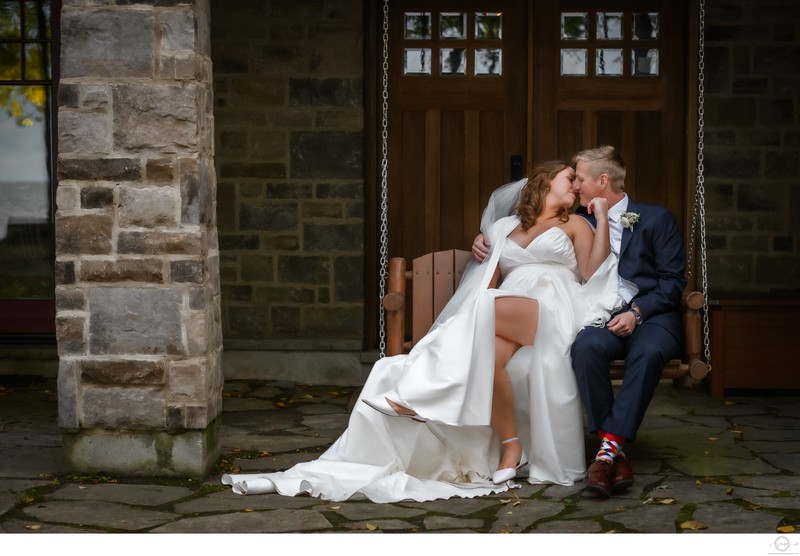 Bride and Groom Share a Kiss on Swing