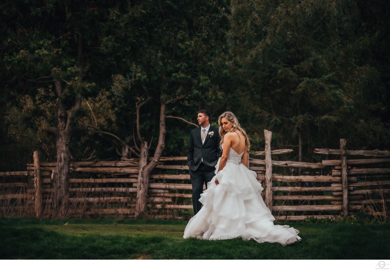 Bride Groom with Wood Fence in Background at Hockley