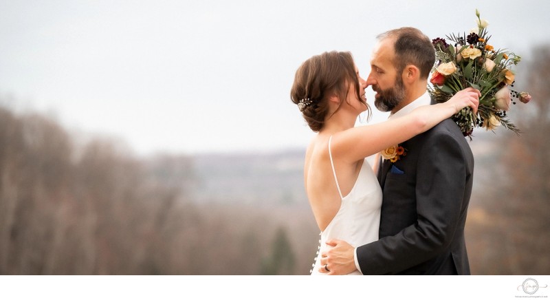 Bride Wraps Arms Around Groom at The Heights of Horseshoe 