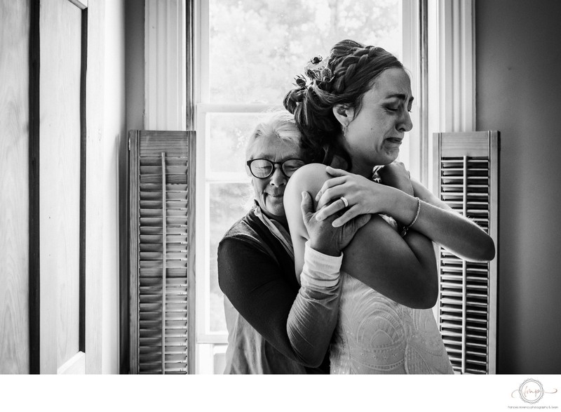 Mother Hugs Bride with Tears in Her Eyes