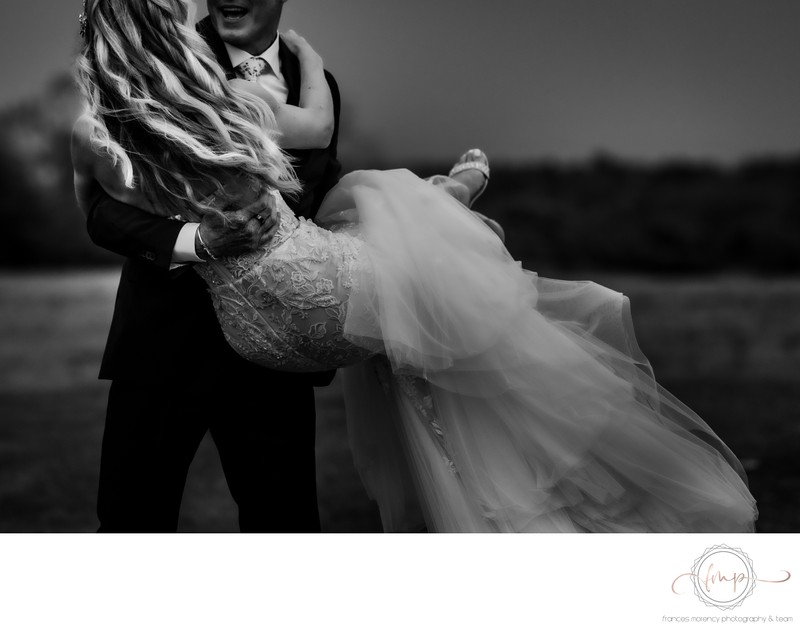 Groom Picks Up Bride During Ceremony Exit