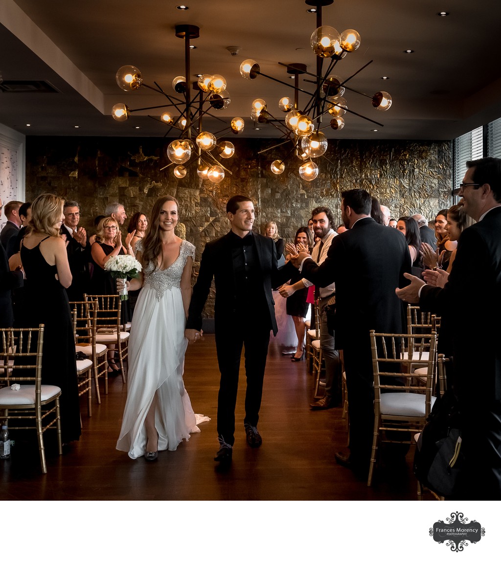 Groom High Fives Guest During Wedding Recessional