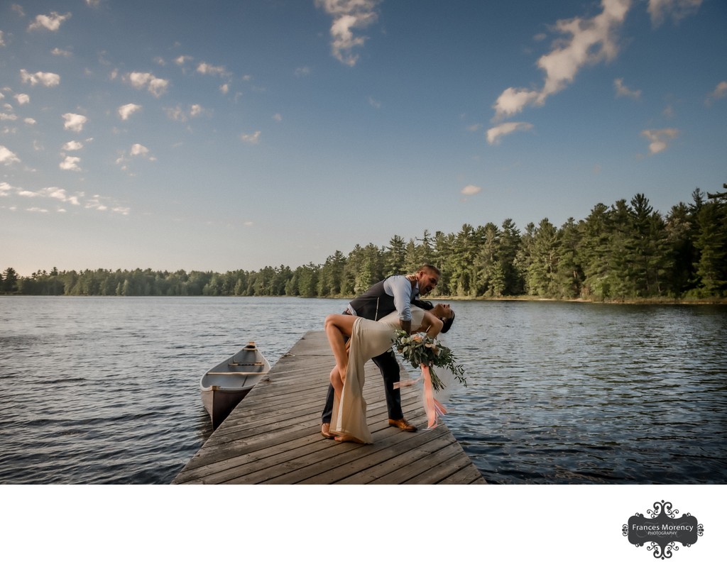 Groom Dips Bride During Recessional on the Dock