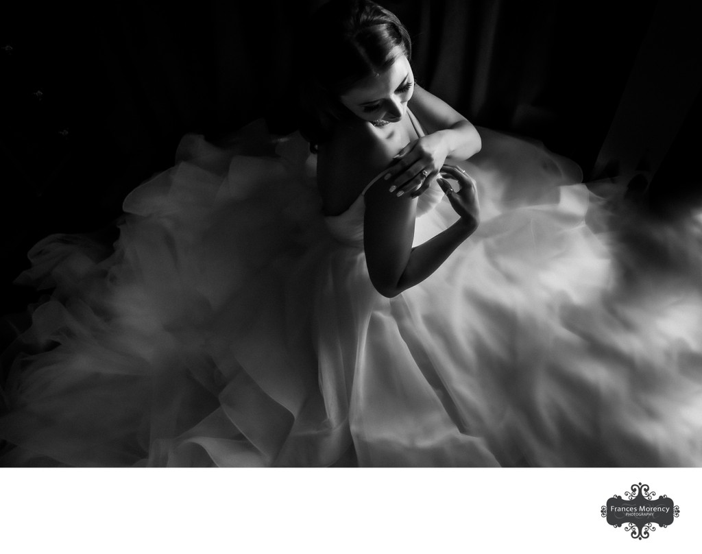 Photojournalistic Portrait of Bride Adjusting Ball Gown