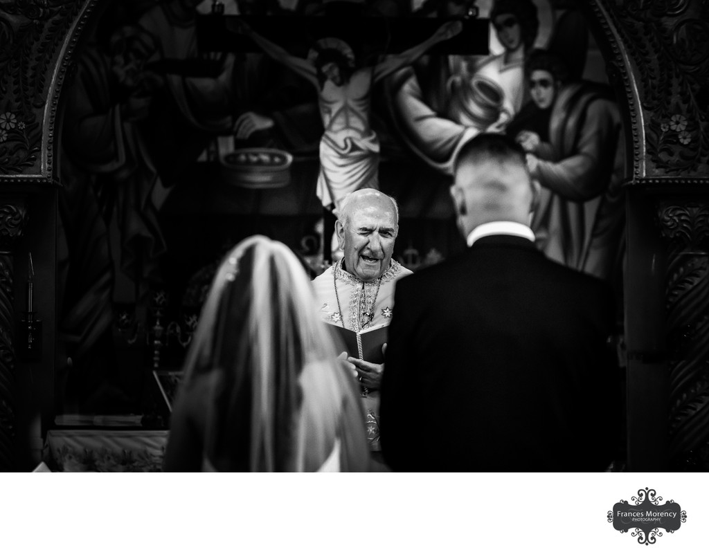 Priest Winks at Greek Wedding Ceremony:  Photojournalism