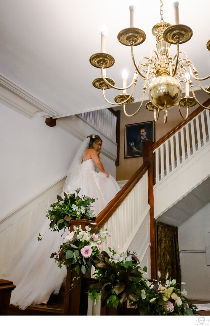 Bride Climbing Stairs in Gown:  Kirkfield Wedding Photo
