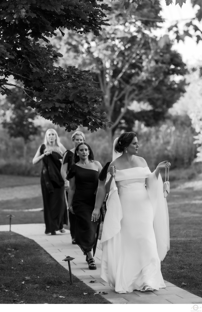 Black & White Candid of Bridesmaids Walking at Belcroft