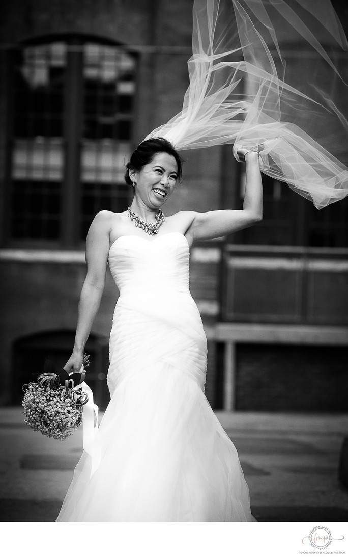 Bride on Windy Day with Veil:  Mildreds Temple Kitchen Wedding