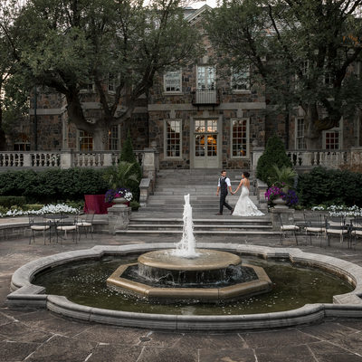 Couple Walking in Front of Fountain at Graydon Hall