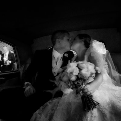 Bride Groom Kissing in Back of Car:  Toronto Wedding