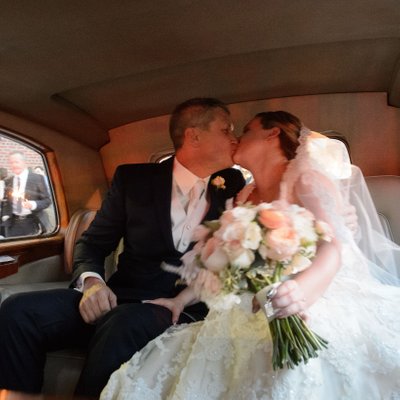Bride Groom Kissing in Back Seat:  Toronto Wedding
