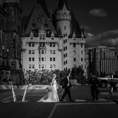 Bride Groom Walking by Castle:  Black White Wedding
