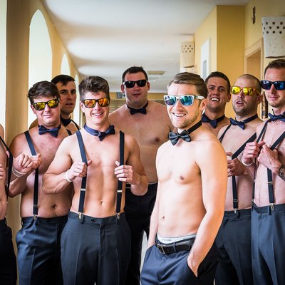 Groomsmen with suspenders:  Destination Wedding Photographer